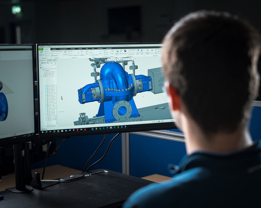 SPP Pumps engineer looking at a computer screen of a pump